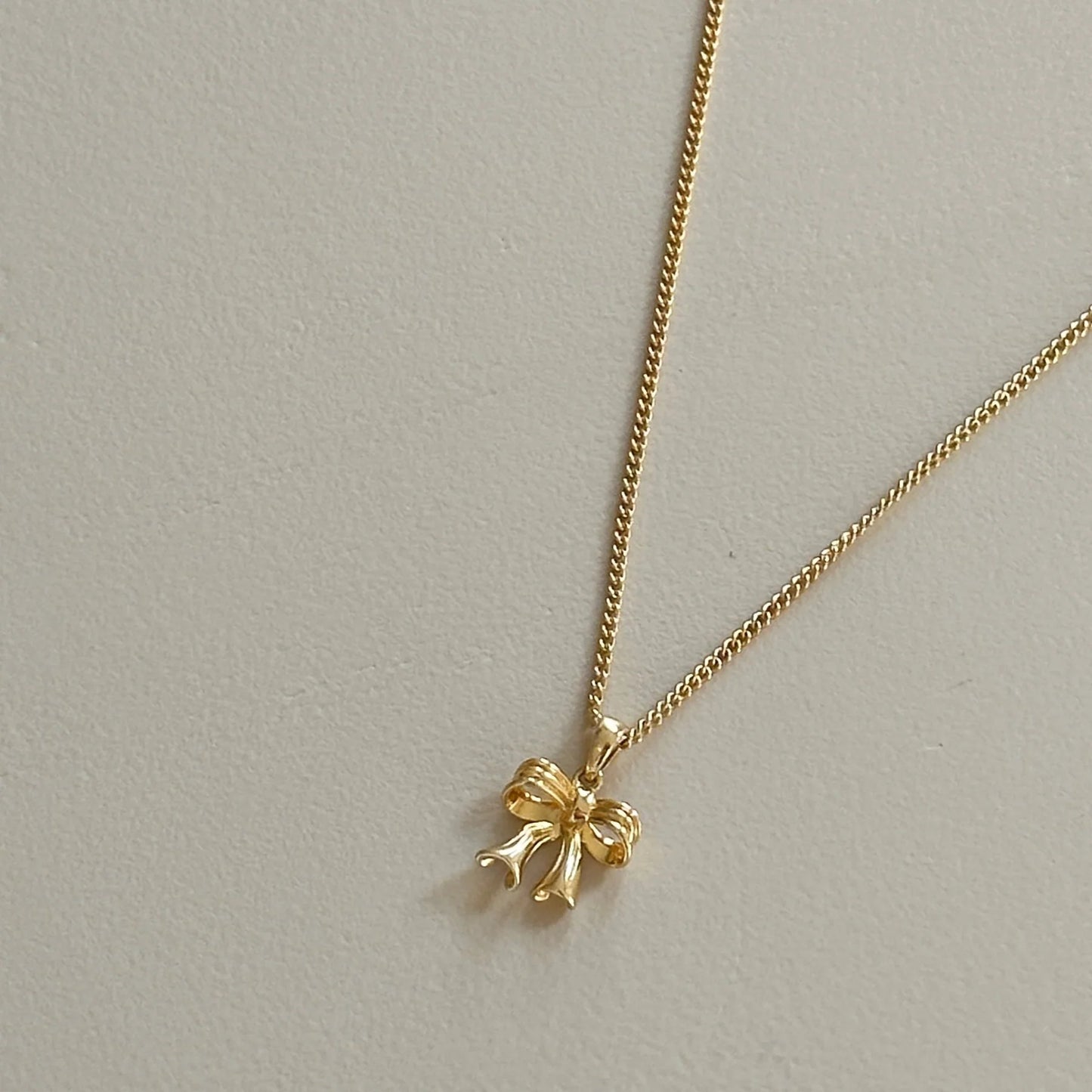 Sterling Silver Yellow Gold Plated Bow Pendant Necklace