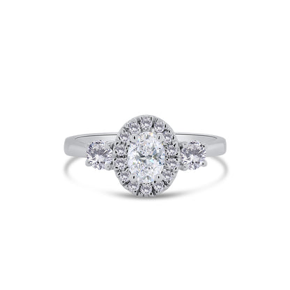 Platinum Oval & Brilliant Round Three Stone & Halo Diamond Ring, 0.71ct