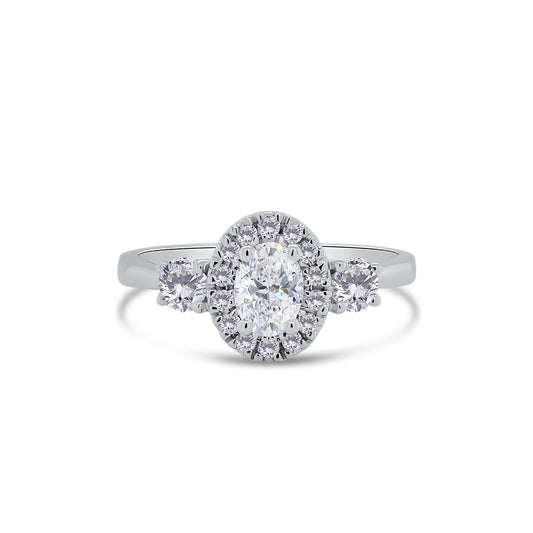 Platinum Oval & Brilliant Round Three Stone & Halo Diamond Ring, 0.71ct